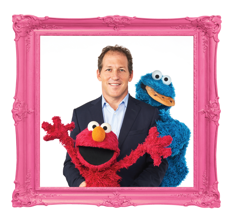 A portrait of Steve Youngwood with Elmo and Cookie Monster in a red square frame