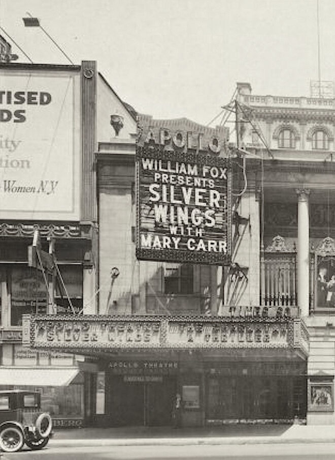 Apollo_Theatre Apollo Theatre marquee with William Fox Presents Silver Wings with Mary Carr spelled out in lighted capital letters, a 1920s era car parked out front