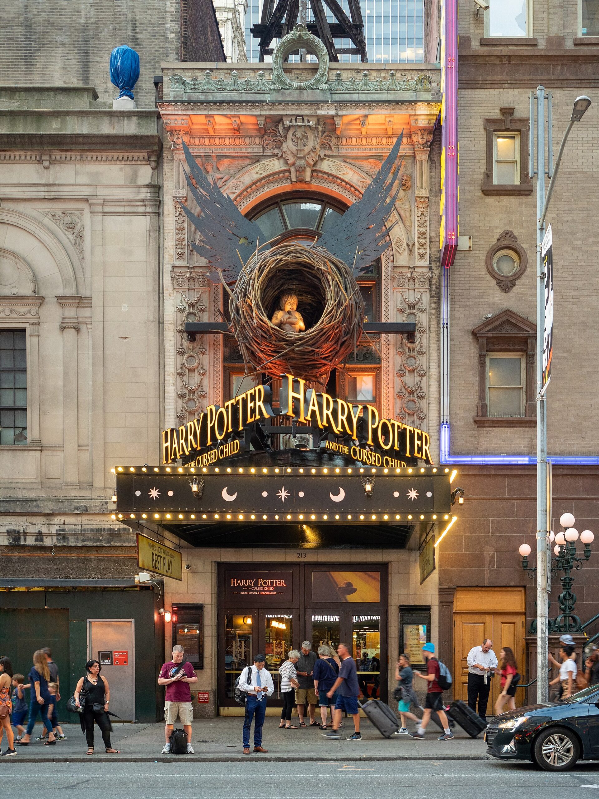 Lyric-Theatre-Harry-Potter-and-the-Cursed-Child Lyric Theatre marquee for Harry Potter with a boy sitting in a bird's nest with wings resembling a golden snitch