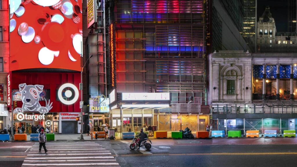 Facade of New 42 Studios, Target to the left and crosswalk with people