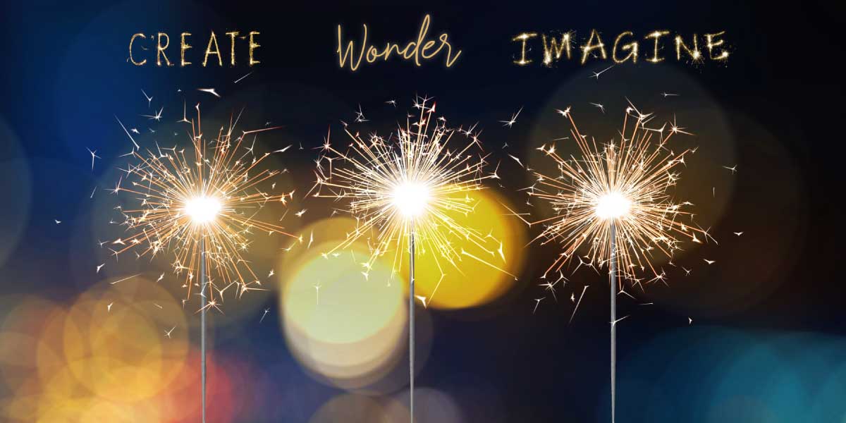 Three sparkler fireworks with words Create, Wonder and Imagine above them